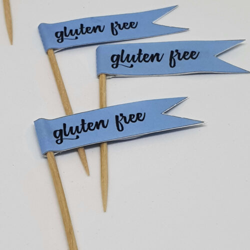 Pastel blue GLUTEN FREE toothpick food flags close up image