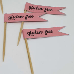 Pastel orange GLUTEN FREE toothpick food flags close up image
